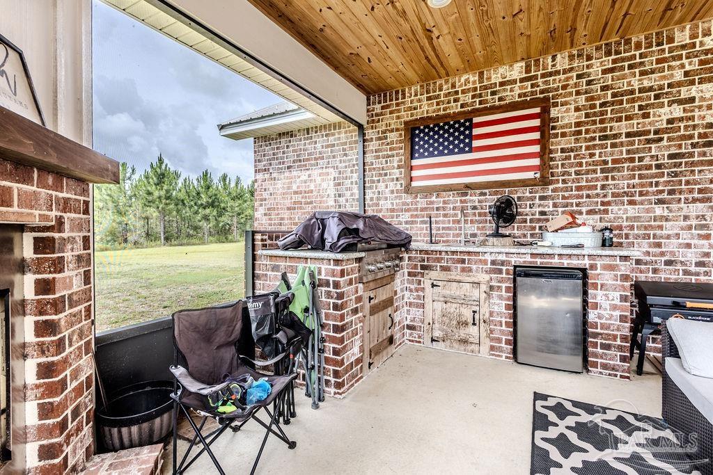 778 Griswold Road Jay, FL 32565 - Photo 33 of 57 a view of a chairs and table in the patio