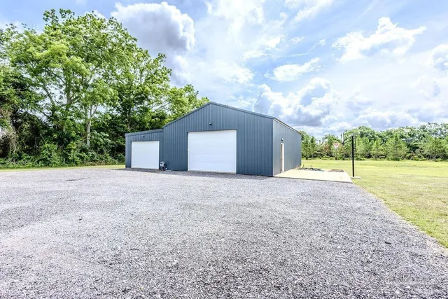 a view of a garage with a bike and car