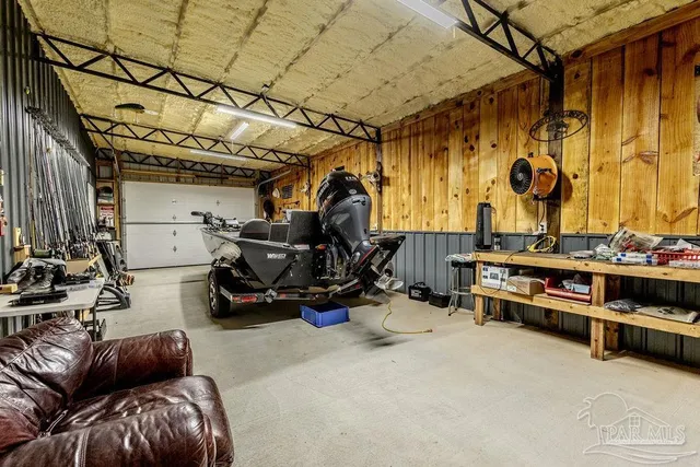 a view of a garage with parked cars