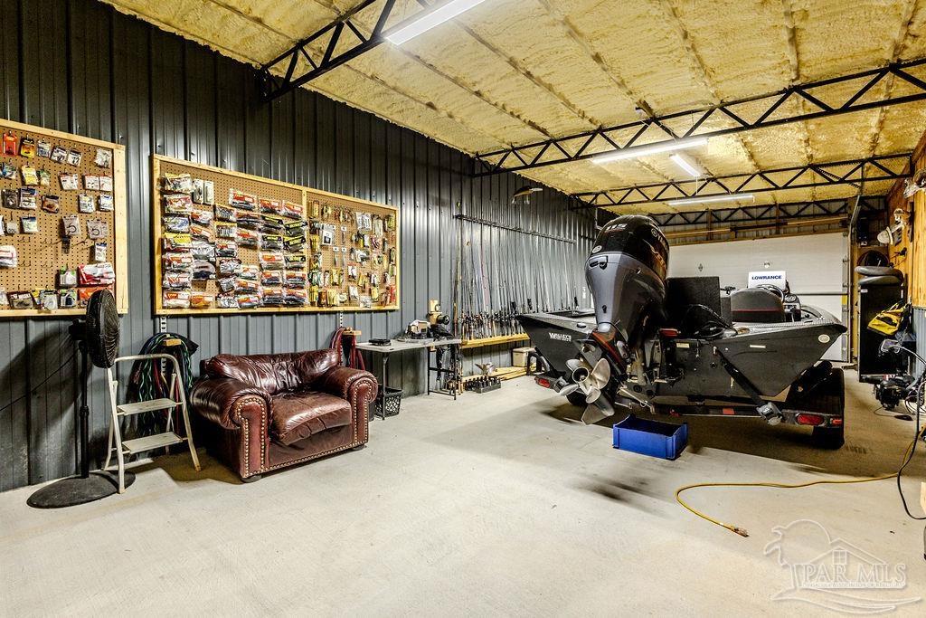 778 Griswold Road Jay, FL 32565 - Photo 37 of 57 a room with gym equipment and a large window