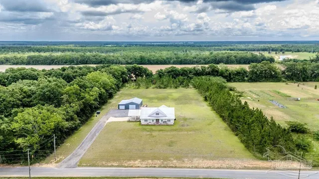 a view of a yard with an outdoor seating