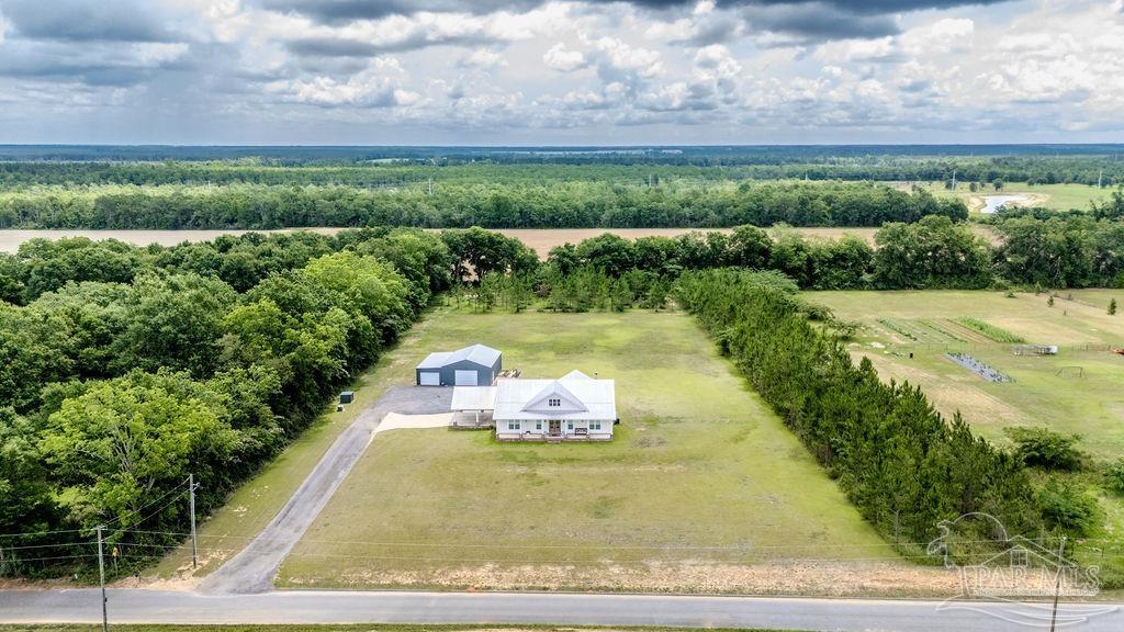 778 Griswold Road Jay, FL 32565 - Photo 4 of 57 a view of a yard with an outdoor seating