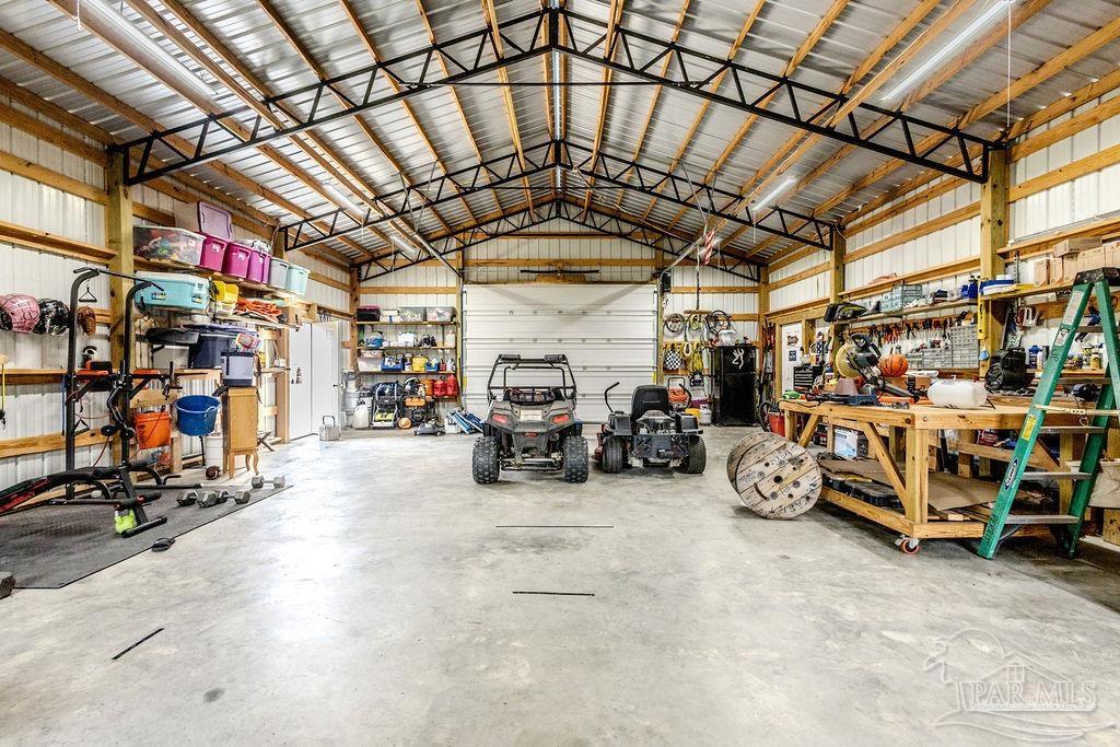 778 Griswold Road Jay, FL 32565 - Photo 42 of 57 a view of a garage with parked cars