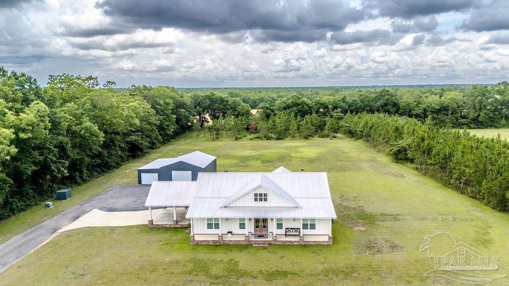 778 Griswold Road Jay, FL 32565 - Photo 46 of 57 a view of a lake with a big yard