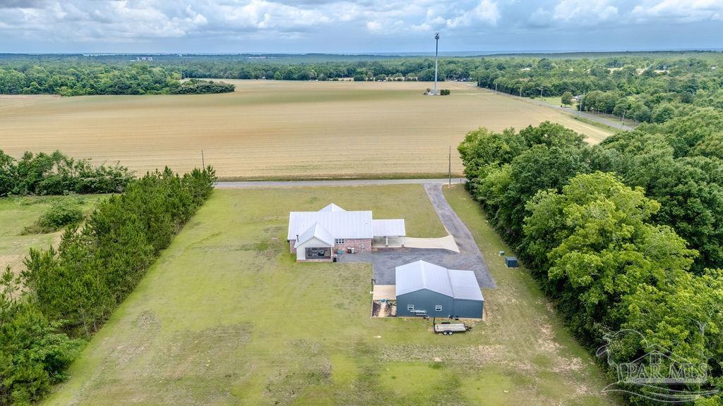 778 Griswold Road Jay, FL 32565 - Photo 52 of 57 a view of a lake with a yard