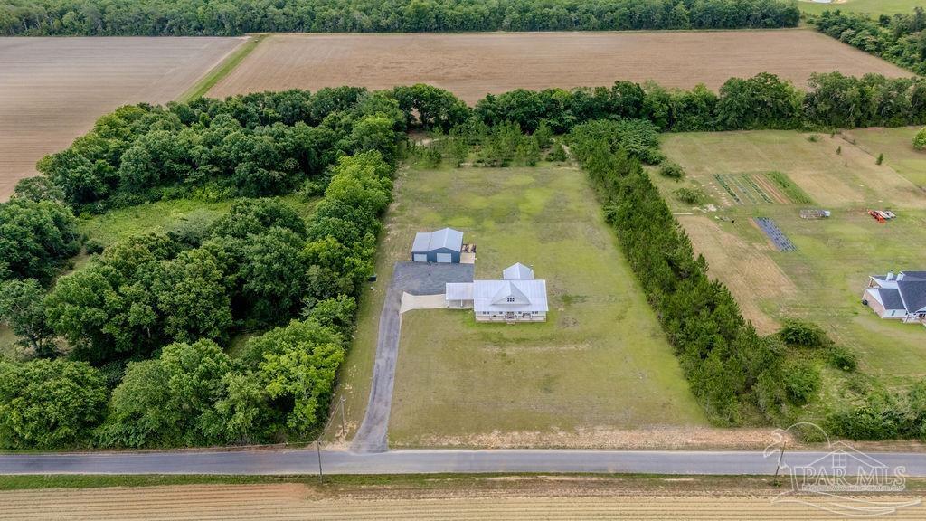 778 Griswold Road Jay, FL 32565 - Photo 56 of 57 an aerial view of a house with a yard and lake view
