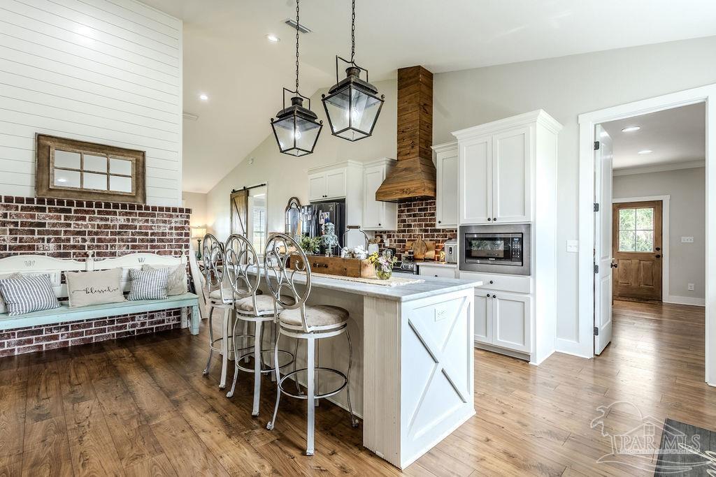 778 Griswold Road Jay, FL 32565 - Photo 10 of 57 a very nice looking kitchen with a large window cabinets and stainless steel appliances