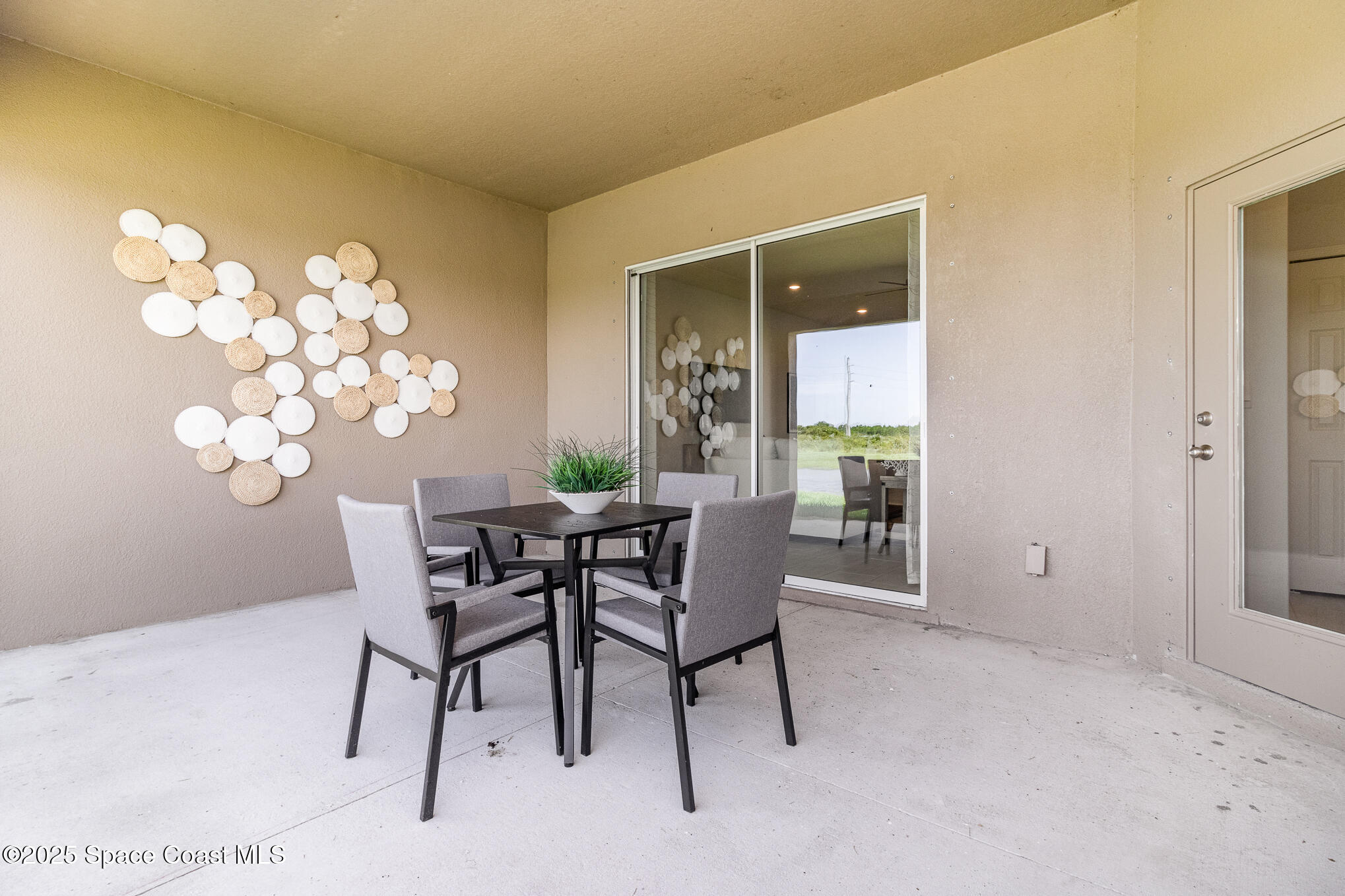 6981 Cameo Drive Grant, FL 32949 - Photo 20 of 48 a dining room with furniture and a potted plant