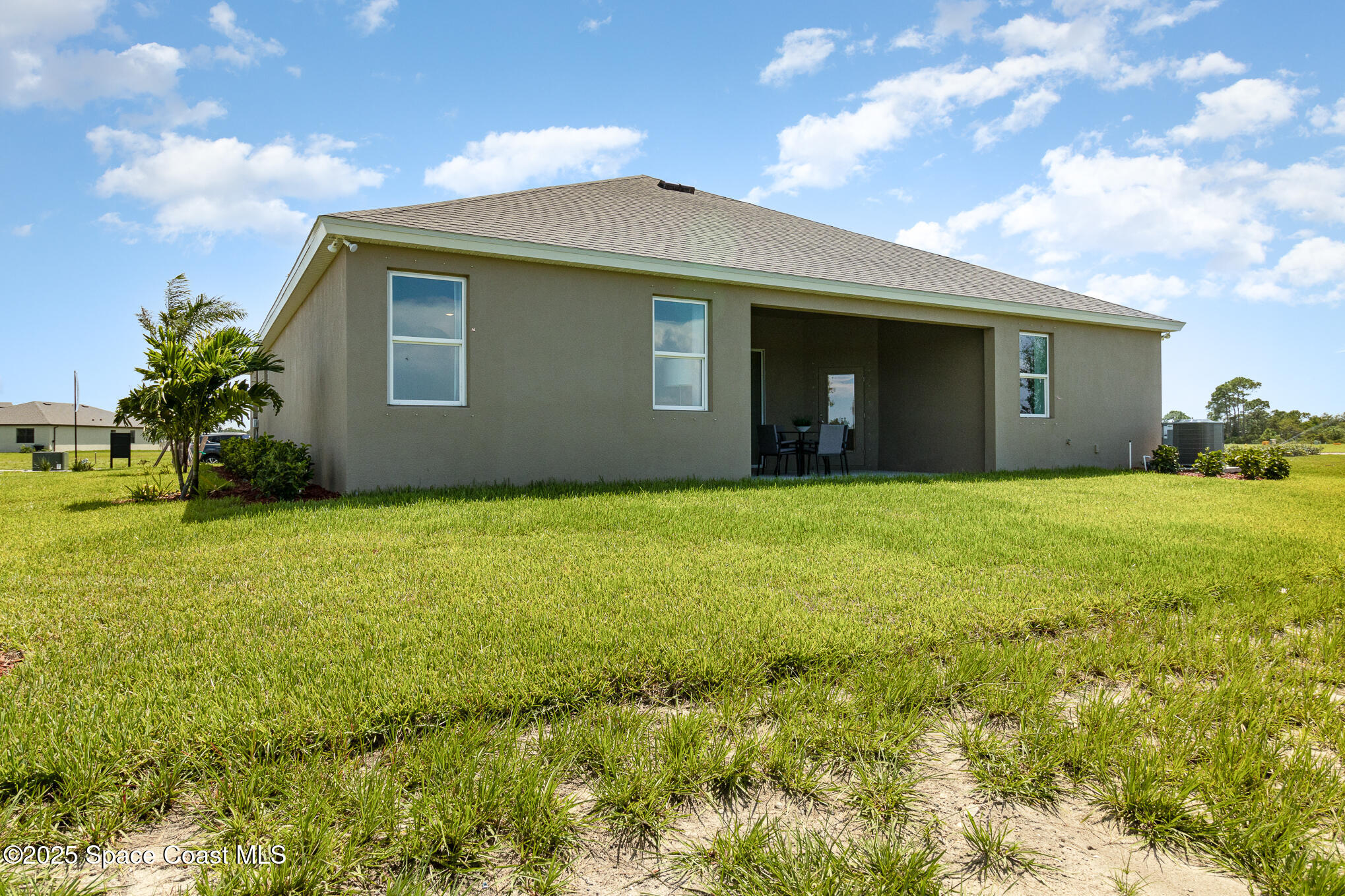 6981 Cameo Drive Grant, FL 32949 - Photo 21 of 48 a front view of house with yard and trees