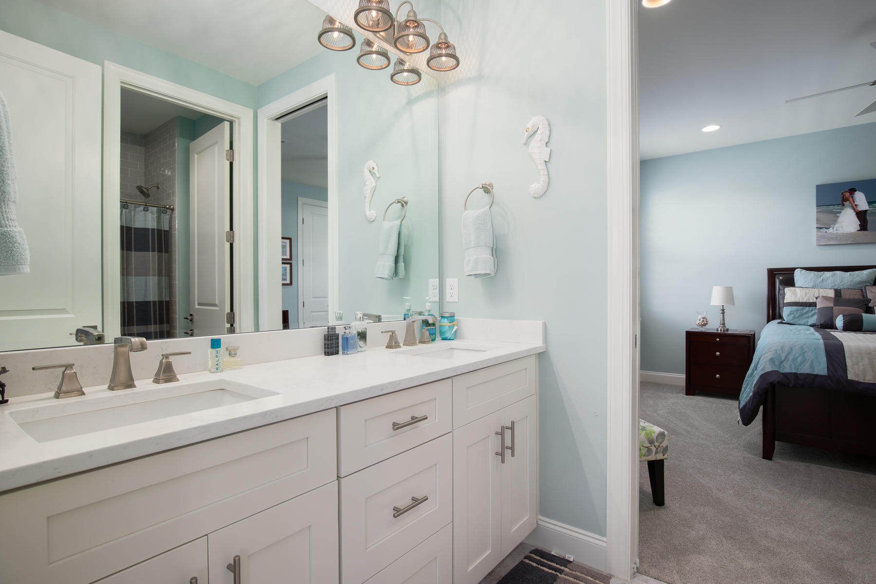 22 Roundwood Drive, Unit LOT 294 Watersound, FL 32461 - Photo 17 of 32 a en suite bathroom with double vanity a sink and a mirror