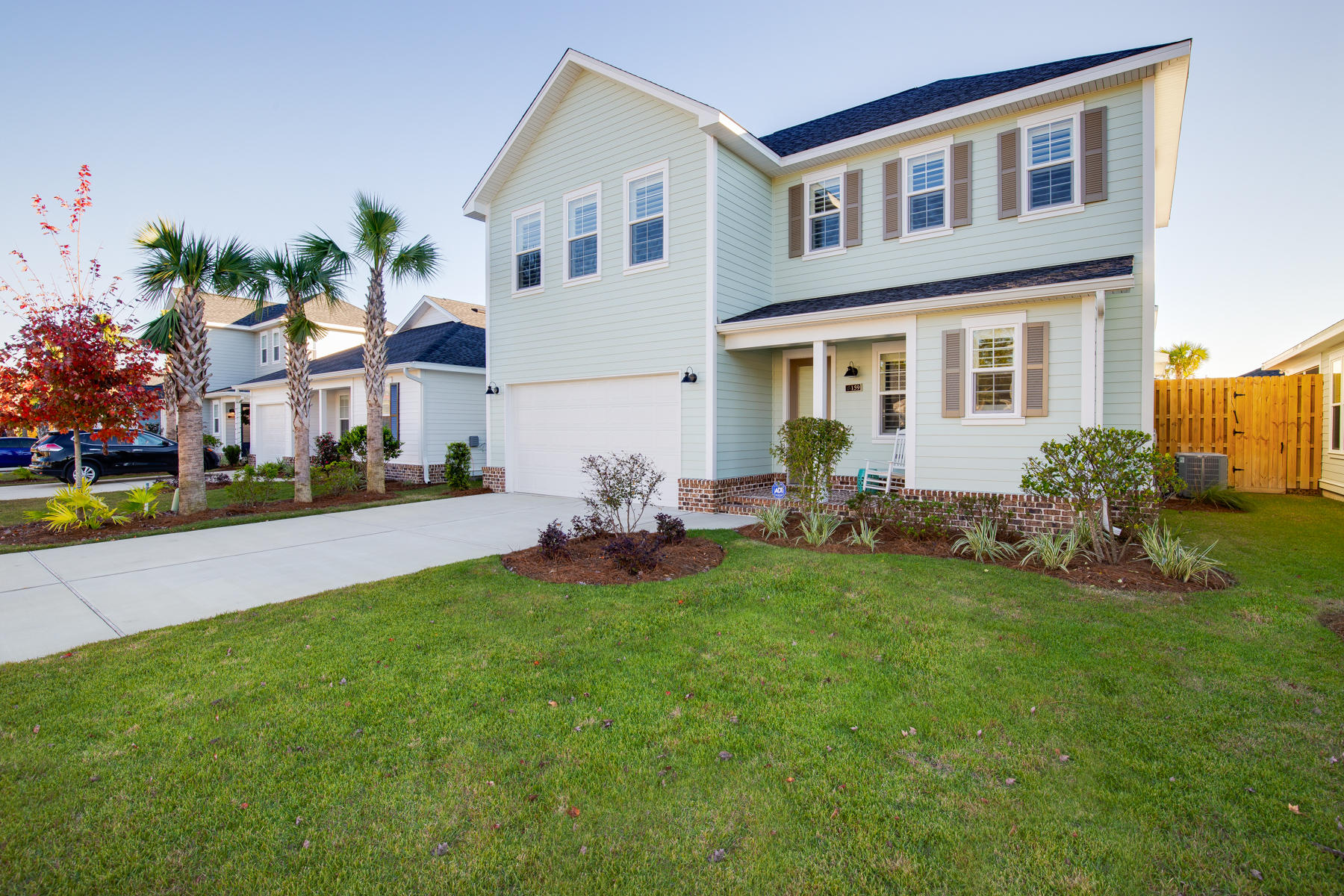 22 Roundwood Drive, Unit LOT 294 Watersound, FL 32461 - Photo 2 of 32 a front view of house with yard and outdoor seating