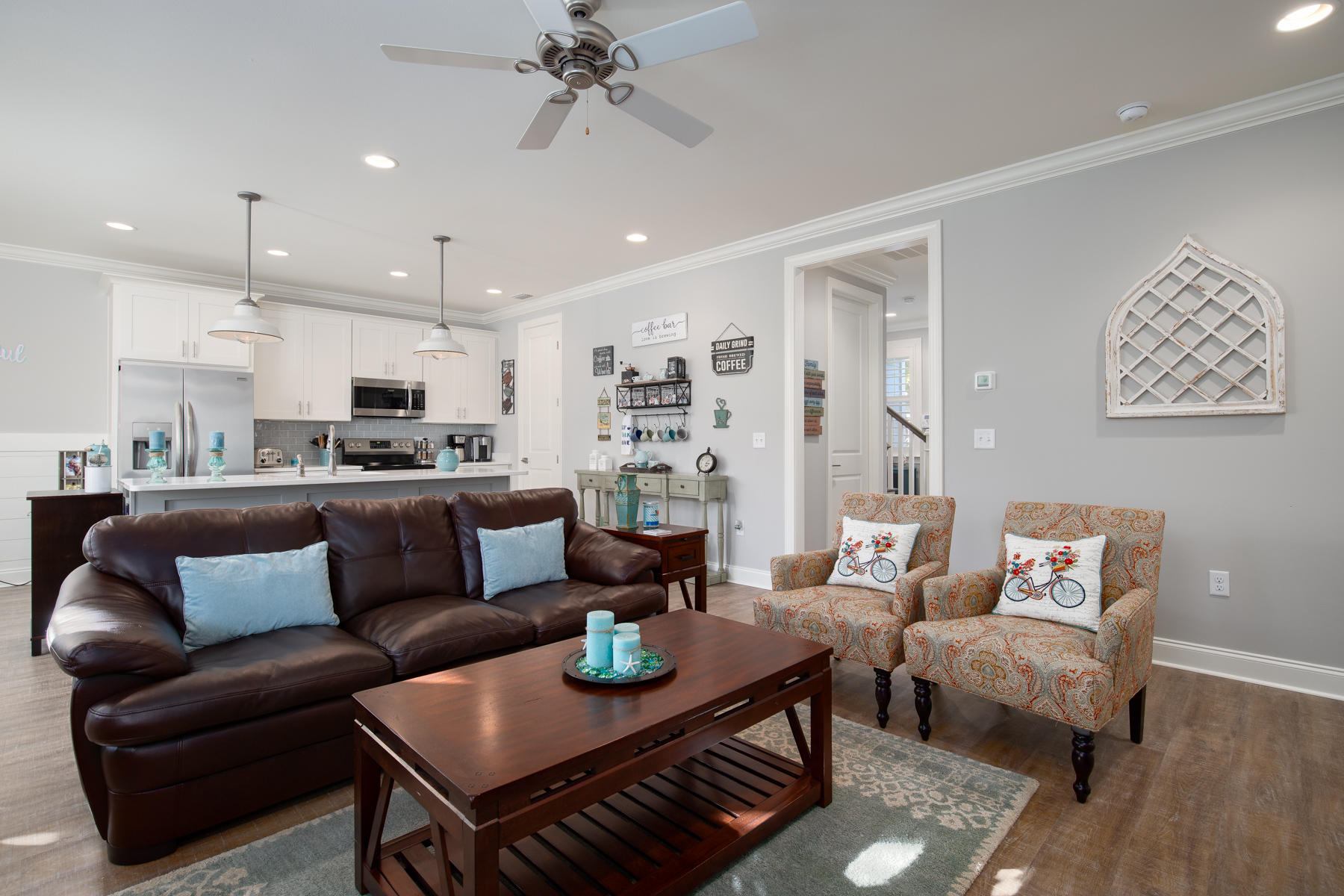22 Roundwood Drive, Unit LOT 294 Watersound, FL 32461 - Photo 8 of 32 a living room with furniture kitchen view and a chandelier