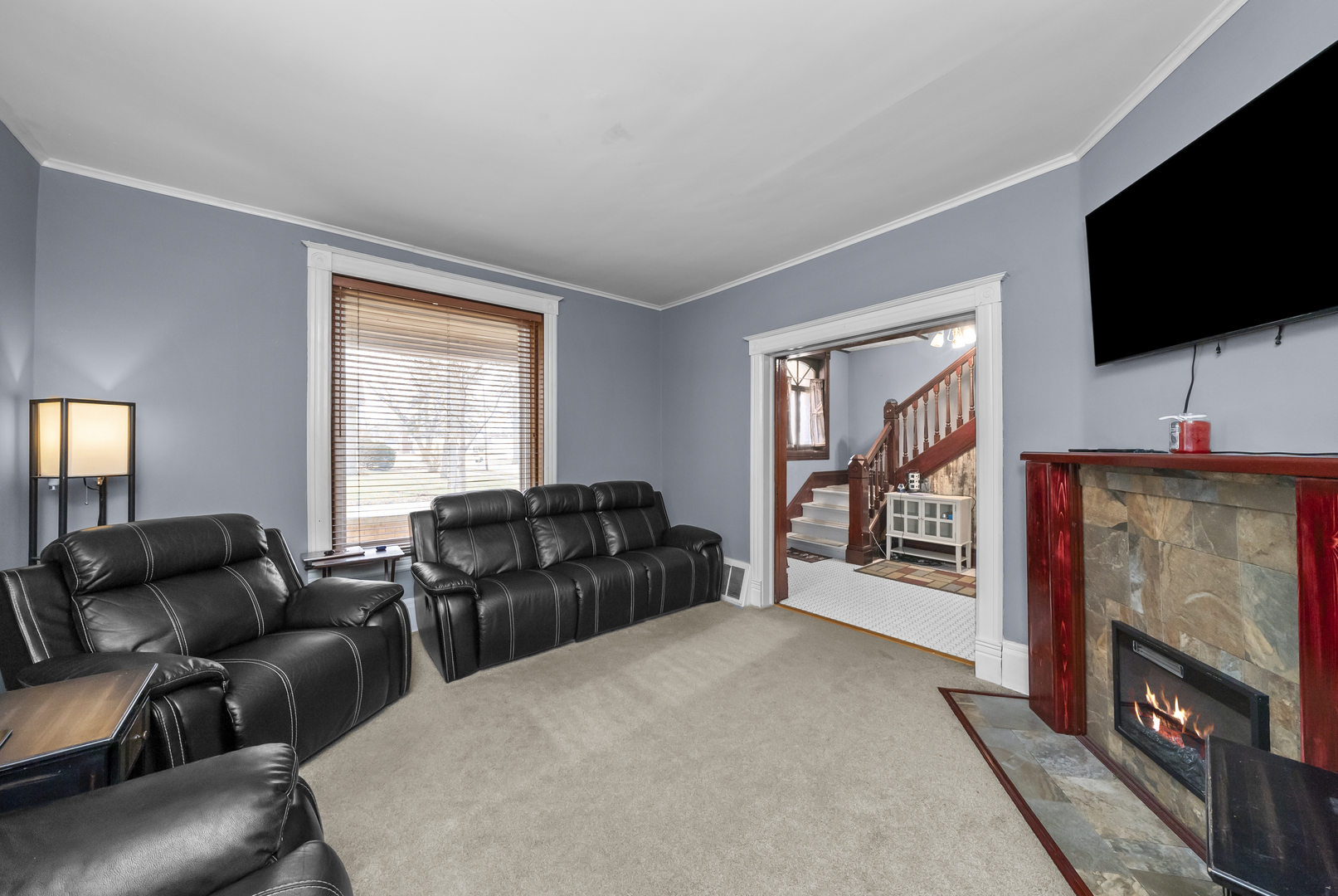 516 Catherine Street Ottawa, IL 61350 - Photo 19 of 38 a living room with furniture and a flat screen tv
