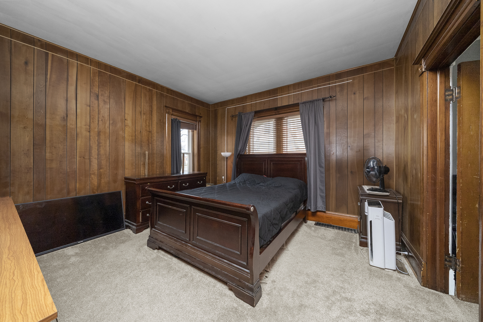 516 Catherine Street Ottawa, IL 61350 - Photo 20 of 38 a bed sitting in a room next to a window