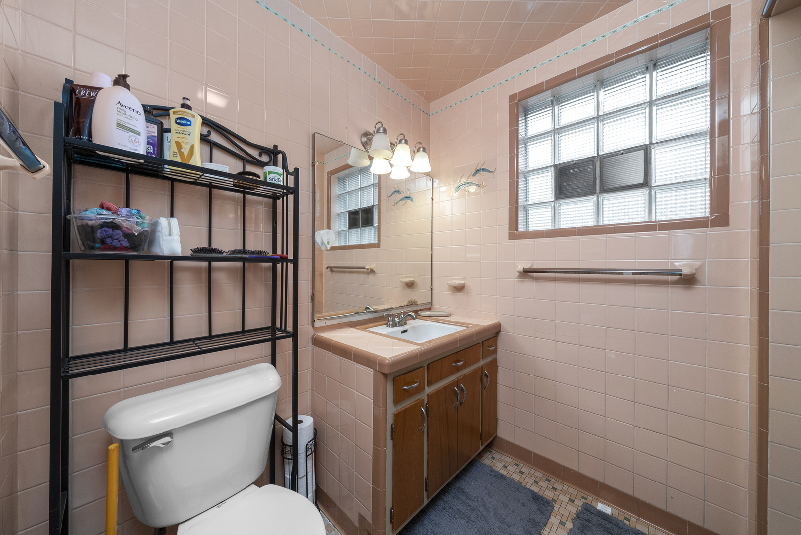 516 Catherine Street Ottawa, IL 61350 - Photo 21 of 38 a bathroom with a toilet a sink and a mirror