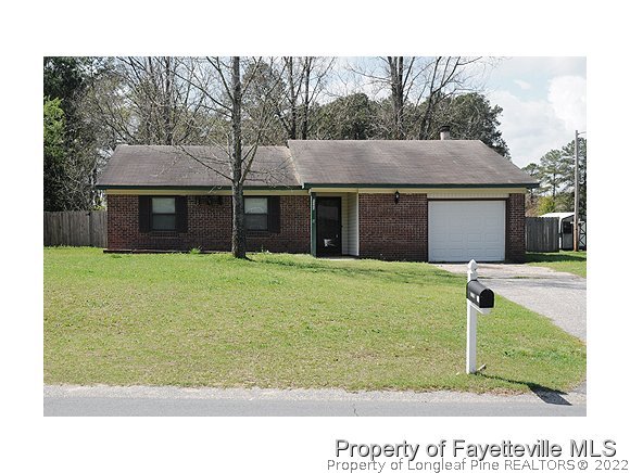 6486 Green Meadow Road Fayetteville, NC 28304 - Photo 1 of 10 a view of a house with a yard