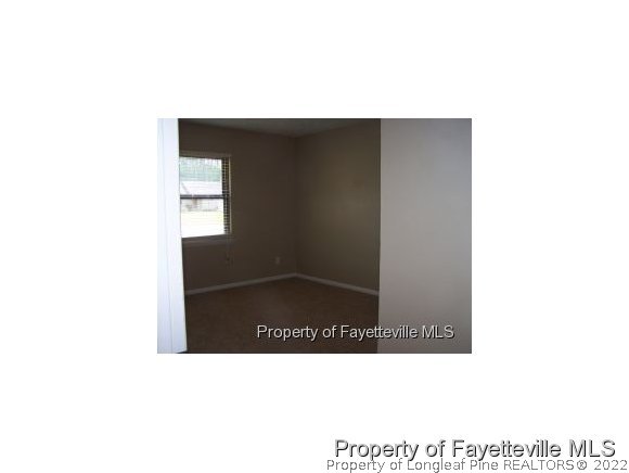 6486 Green Meadow Road Fayetteville, NC 28304 - Photo 3 of 10 a black and white photo of a living room