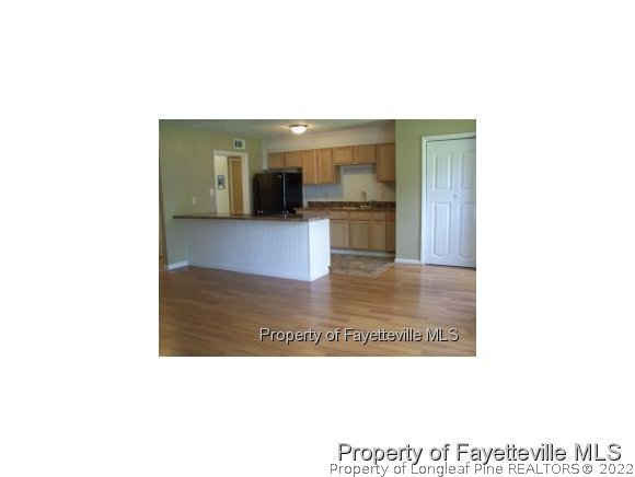 6486 Green Meadow Road Fayetteville, NC 28304 - Photo 5 of 10 a bathroom with a sink and a mirror