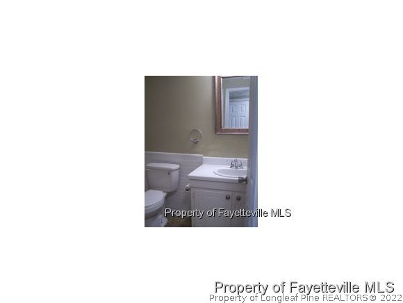 6486 Green Meadow Road Fayetteville, NC 28304 - Photo 8 of 10 a bathroom with a toilet