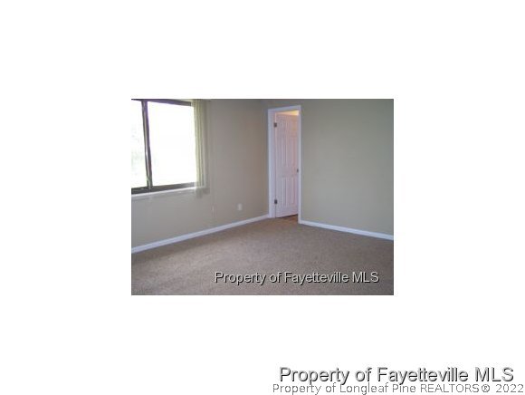 6486 Green Meadow Road Fayetteville, NC 28304 - Photo 10 of 10 a open living room with a wooden floor