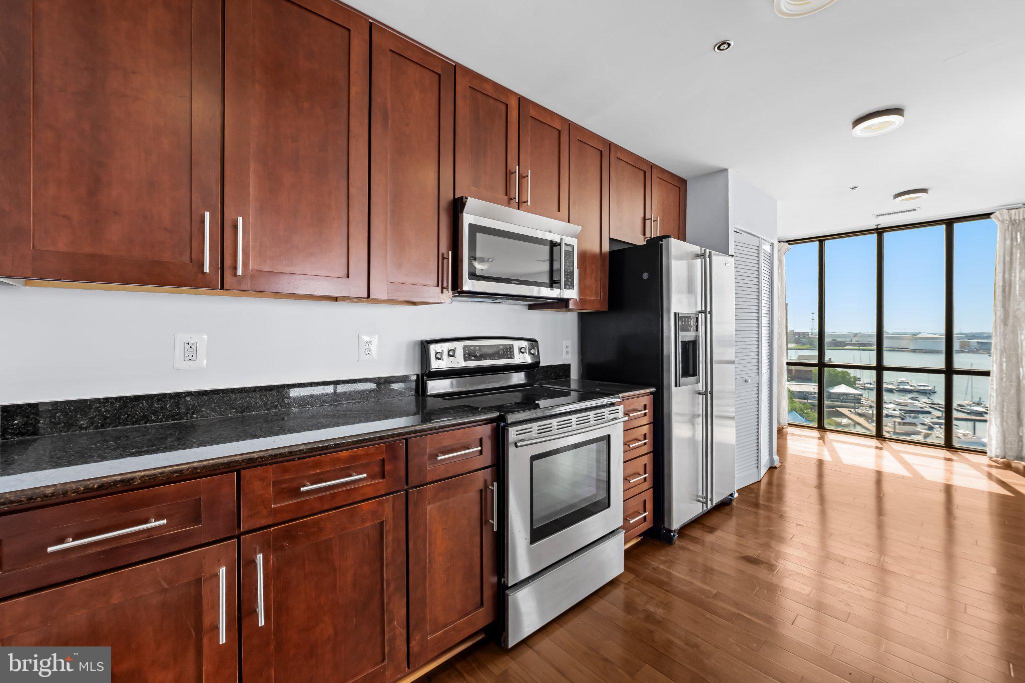 2702 Lighthouse Point East, Unit 738 Baltimore, MD 21224 - Photo 7 of 33 Modern kitchen with stunning views.