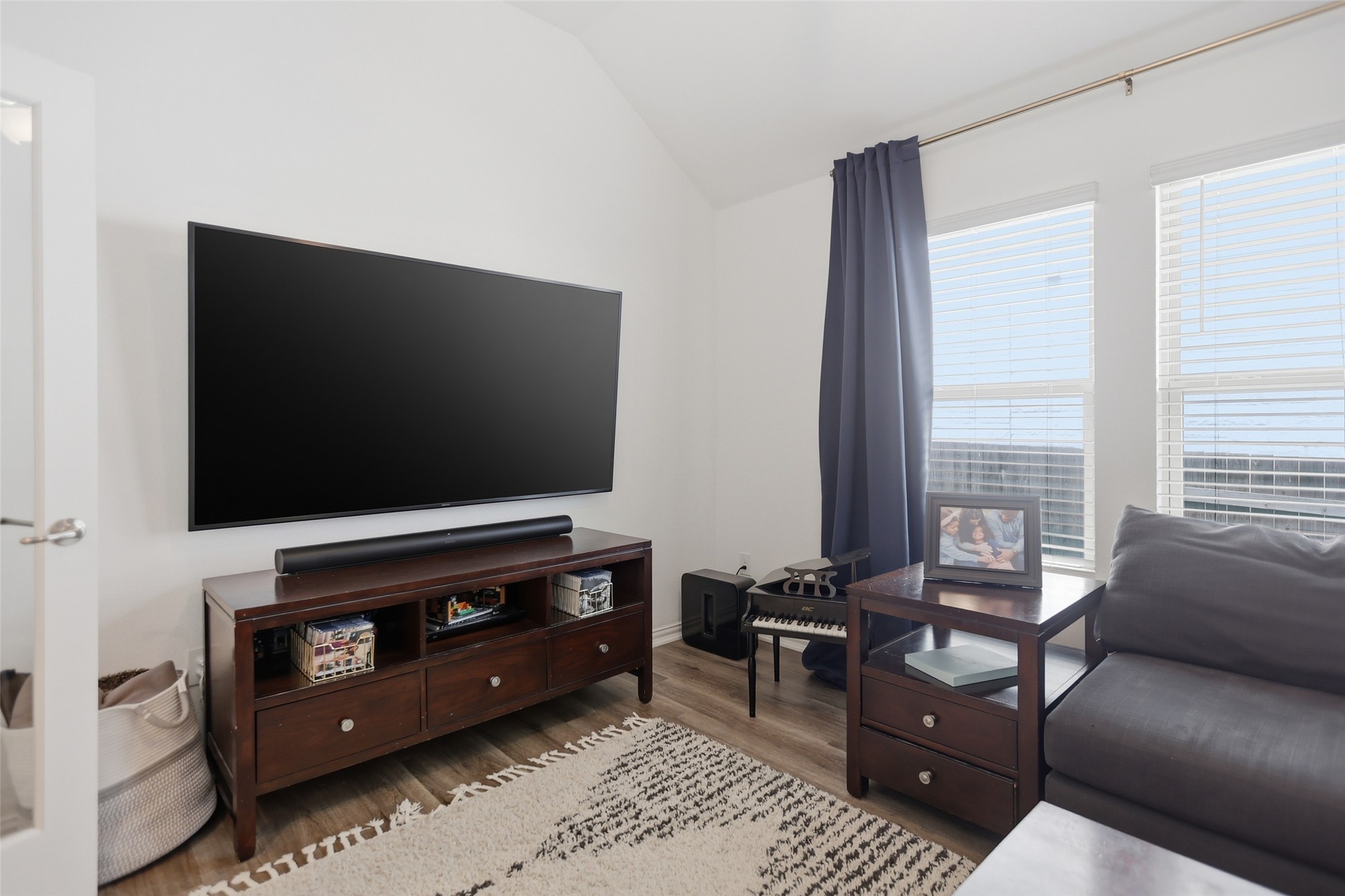 544 Cherrystone Loop Buda, TX 78610 - Photo 24 of 40 a living room with furniture and a flat screen tv