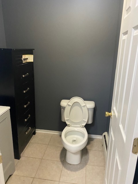 143 West Elk Trail, Unit 342 Carol Stream, IL 60188 - Photo 12 of 13 a white toilet sitting next to a bathroom sink