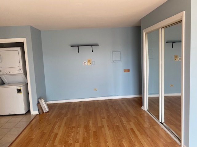 143 West Elk Trail, Unit 342 Carol Stream, IL 60188 - Photo 3 of 13 a view of a room with wooden floor and bathroom