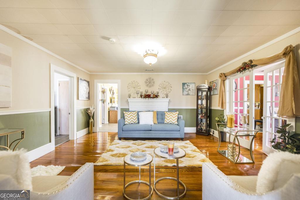 751 Findley Road Pinehurst, GA 31070 - Photo 13 of 47 a living room with furniture and a large window
