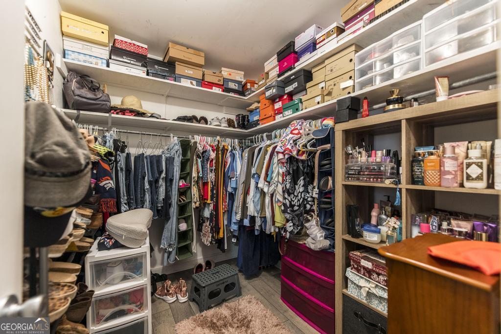 751 Findley Road Pinehurst, GA 31070 - Photo 26 of 47 a view of walk in closet with clothes and shoes
