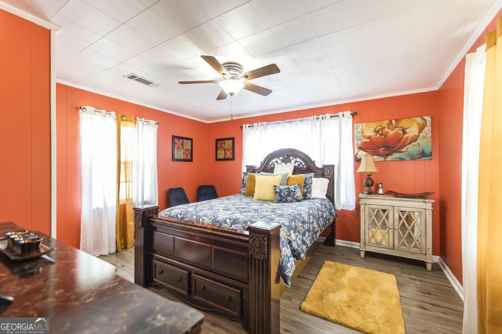 751 Findley Road Pinehurst, GA 31070 - Photo 27 of 47 a bedroom with a bed and a dresser