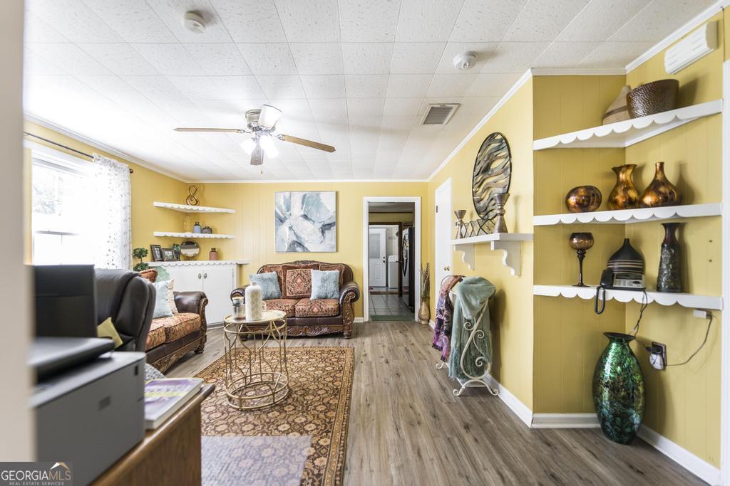 751 Findley Road Pinehurst, GA 31070 - Photo 29 of 47 a view of a living room with furniture and a flat screen tv