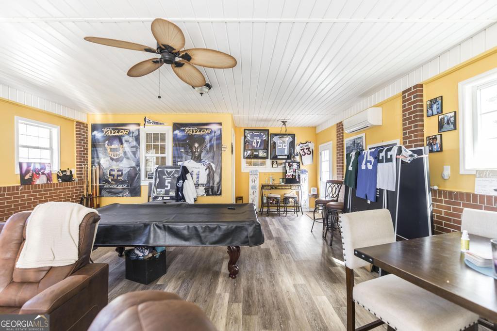 751 Findley Road Pinehurst, GA 31070 - Photo 35 of 47 a living room with furniture and a large window