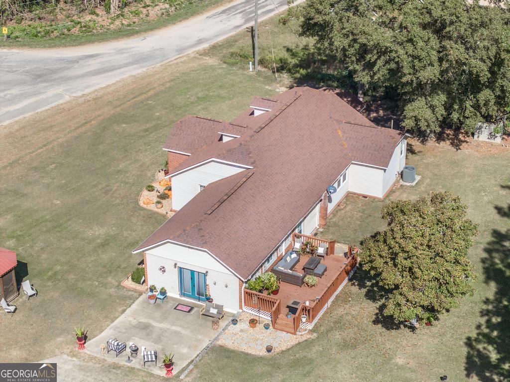 751 Findley Road Pinehurst, GA 31070 - Photo 44 of 47 an aerial view of a house with a yard and lake view