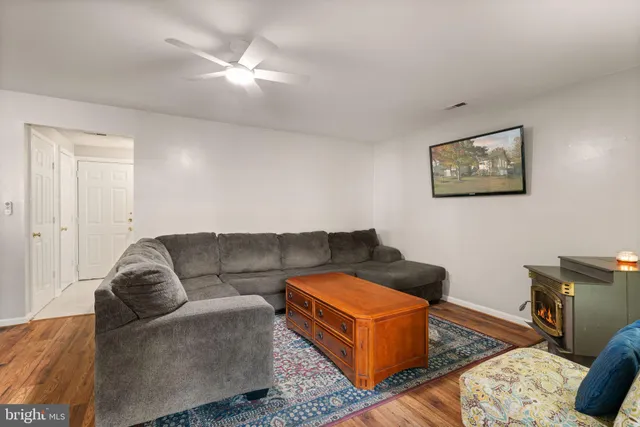 a large kitchen with a table and chairs