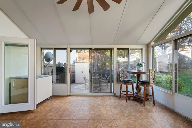 a view of game room with windows