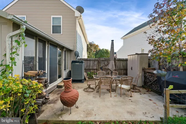 a view of backyard with patio and outdoor seating