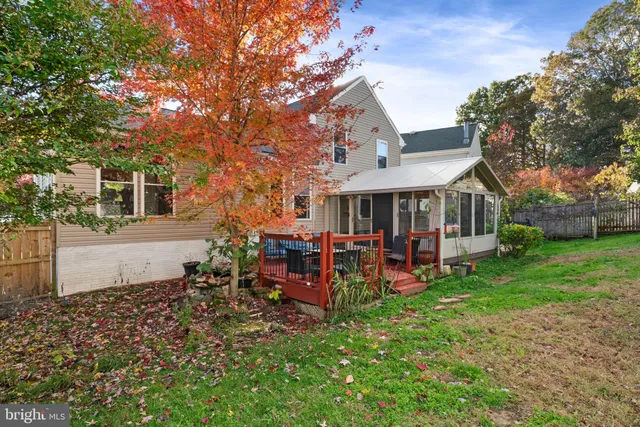 a view of a house with a yard porch and sitting area