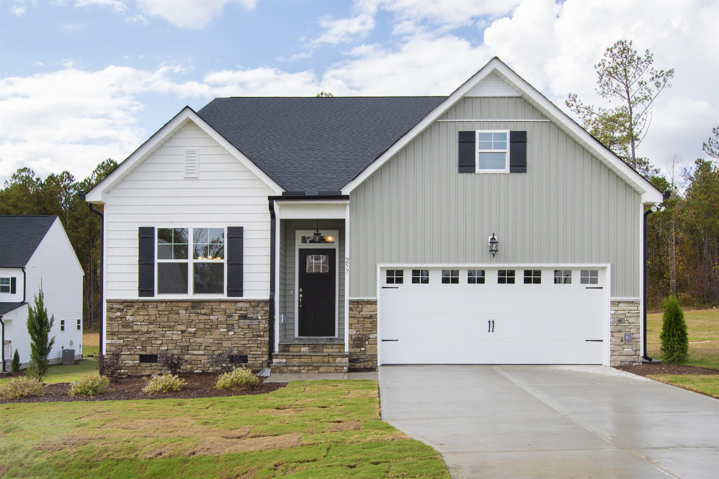 257 Nickleby Way Wendell, NC 27591 - Photo 1 of 58 a front view of a house with a yard