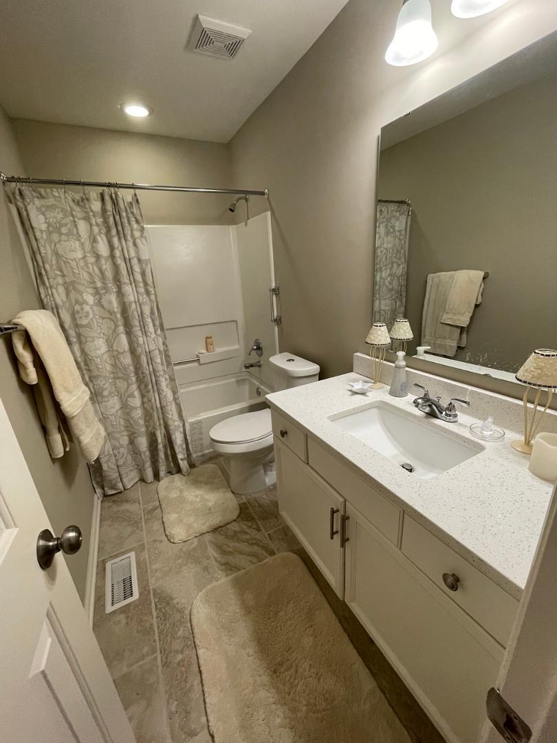 96 Lakeshore Drive Durham, NC 27713 - Photo 14 of 21 a bathroom with a double vanity sink mirror and toilet