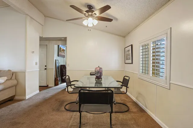 a kitchen with a refrigerator and a sink