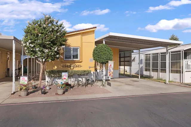 a front view of a house with a outdoor space