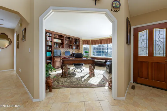 a kitchen with stainless steel appliances granite countertop a stove and cabinets