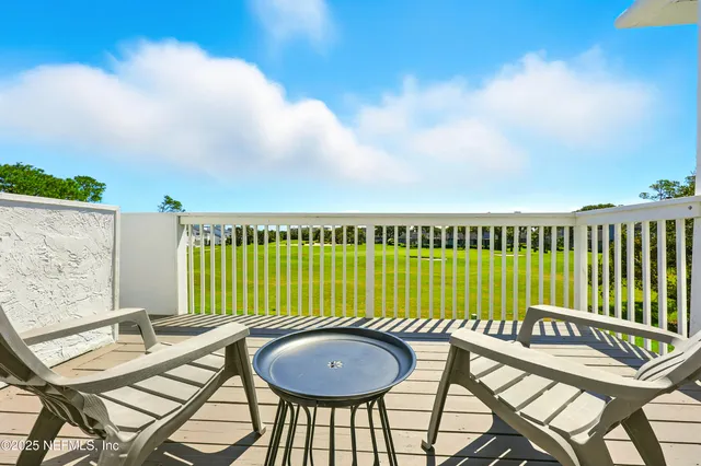 a view of a chairs and tables in the patio