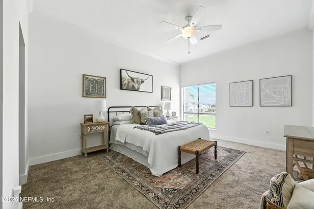 a bed room with a bed and a chandelier