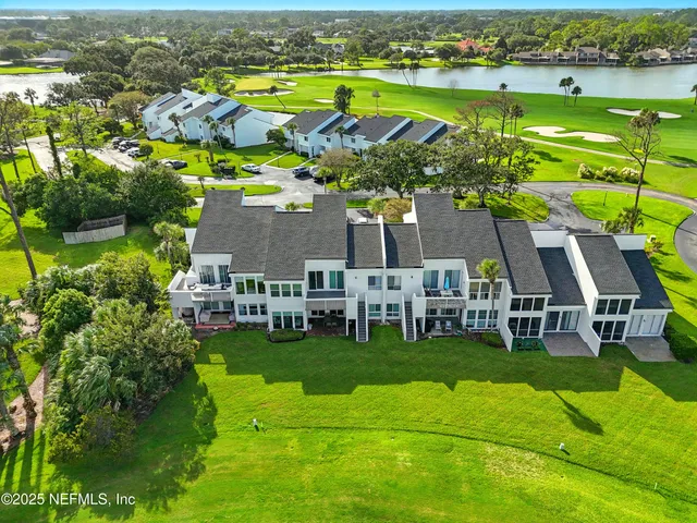 an aerial view of house with yard swimming pool and outdoor seating