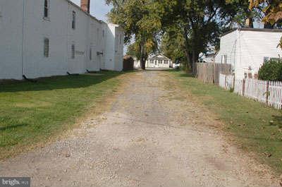 2518 Sparrows Point Road Sparrows Point, MD 21219 - Photo 4 of 19 a view of a yard with large trees