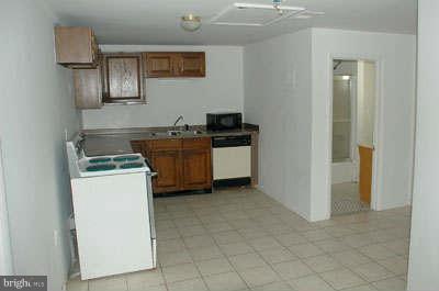 2518 Sparrows Point Road Sparrows Point, MD 21219 - Photo 6 of 19 a kitchen with a stove and a refrigerator