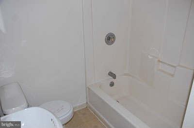 2518 Sparrows Point Road Sparrows Point, MD 21219 - Photo 8 of 19 a bathroom with a sink and toilet