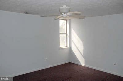 2518 Sparrows Point Road Sparrows Point, MD 21219 - Photo 9 of 19 wooden floor in an empty room with a window